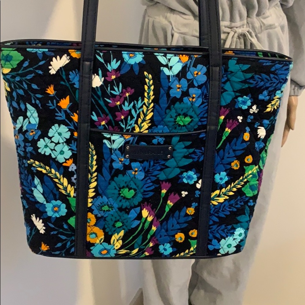 Vera Bradley shoulder length blue floral bag.